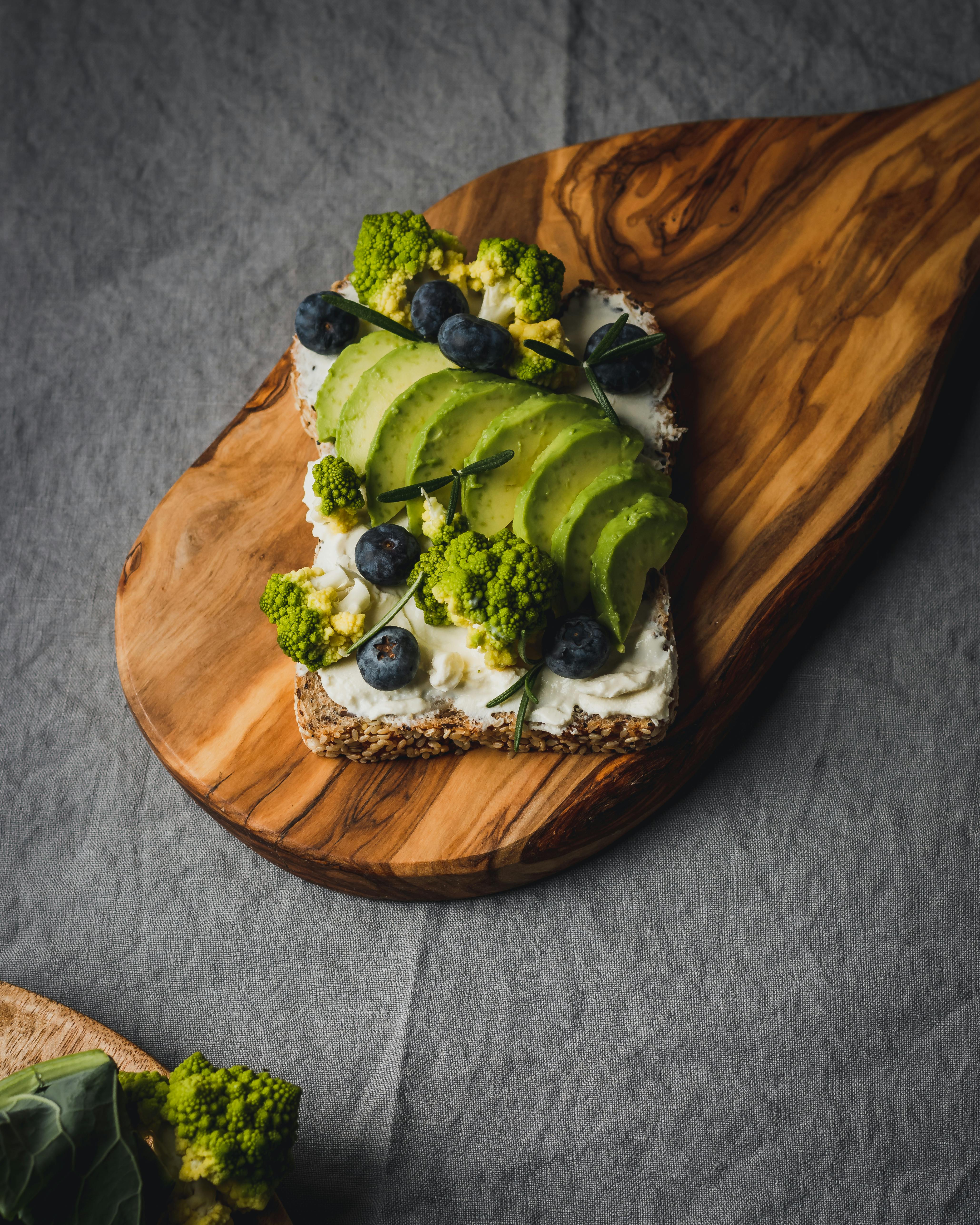 Healthy avocado toast with blueberries and romanesco broccoli