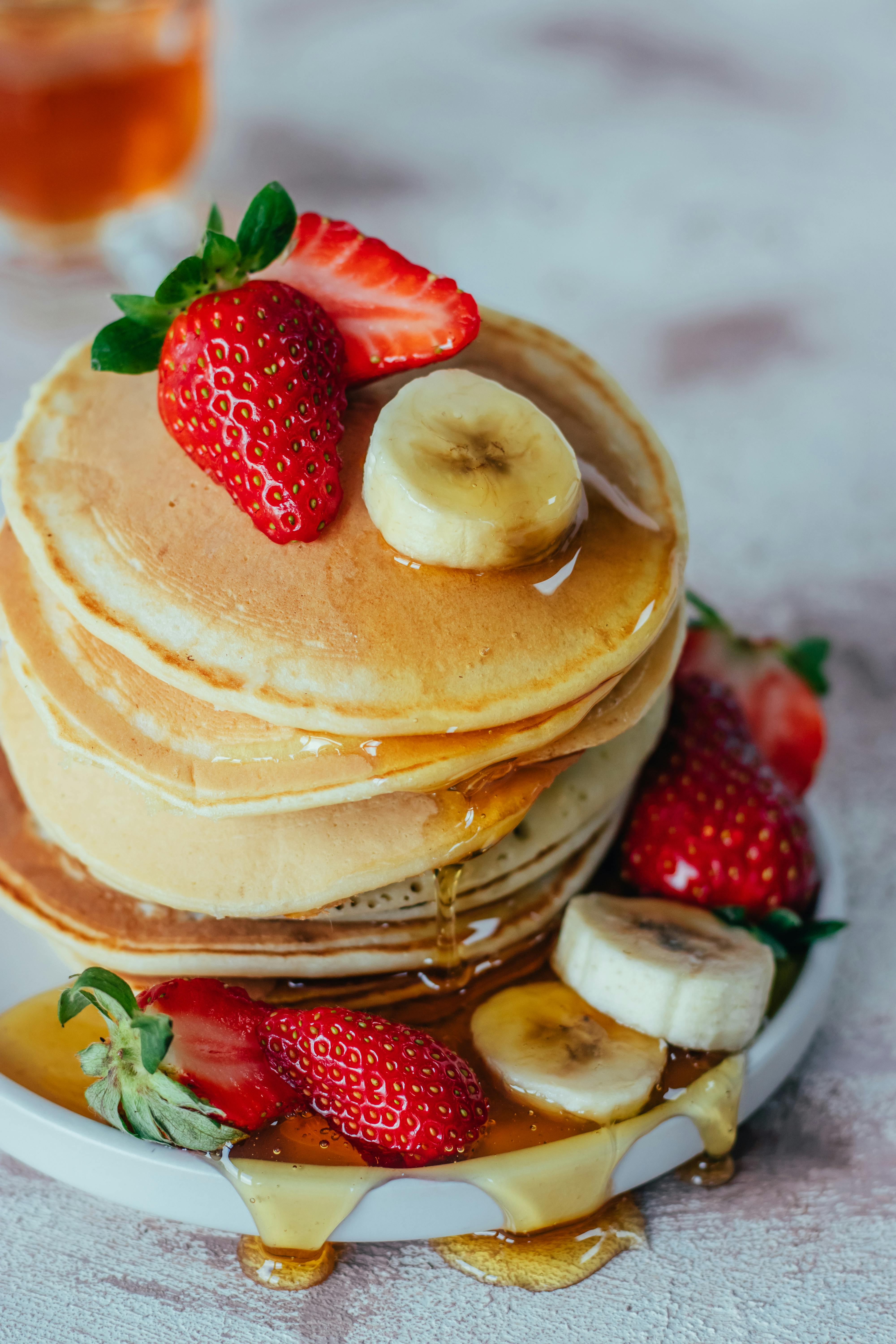 Fresh pancakes with strawberries and banana